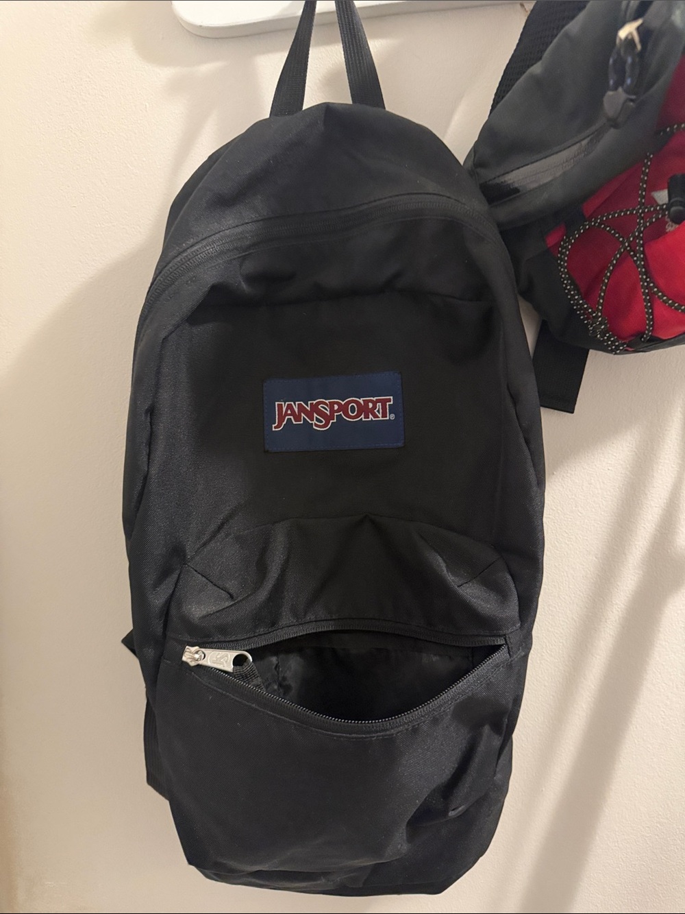Jansport Black Backpack with Navy Logo Patch